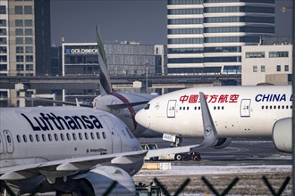 Aircraft on the taxiway at Frankfurt FRA airport, Fraport, in winter, Hesse, Germany, Europe