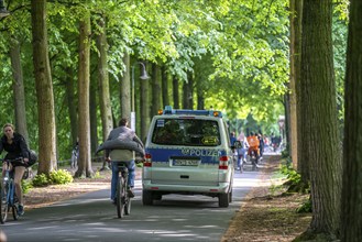 Police patrol on the Promenade cycle path, a tree-lined, car-free, approximately 4.5 km long ring