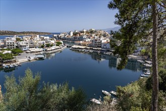 The village of Agios Nikolaos, in the eastern part of Crete, view over Lake Voulismeni, connected