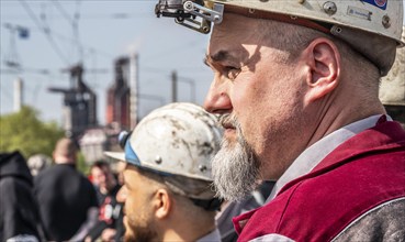 Steelworkers at a demonstration in front of the headquarters of ThyssenKrupp Steel Europe in