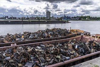 Push barge, loaded with scrap metal, for recycling, melting down, in the harbour canal,