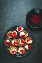 Demidoff pancakes, mini pancakes, with sour cream and red caviar, homemade, no people