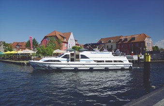 Europe, Germany, Mecklenburg-Western Pomerania, island town of Malchow, Lake Malchow, jetty, motor