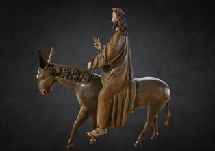 Palm donkey, detail of donkey's head, wooden figure from 1470, on dark background, Franciscan