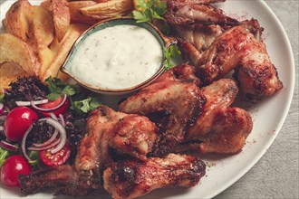 Fried chicken wings, with potatoes, and spices, homemade, fast food, no people