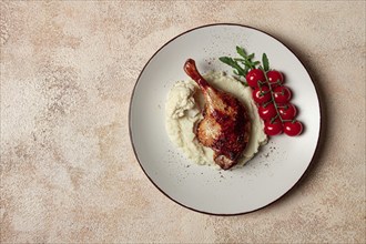 Fried duck shank, cauliflower puree, cherry tomatoes, homemade, no people