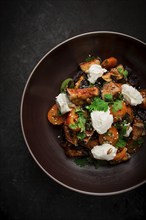 Warm Salad with crispy eggplant and tomatoes, cottage cheese, spices, herbs, sesame seeds,