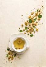 Chrysanthemum tea, drink, white cup, mint, chrysanthemum buds, close-up, no people