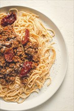 Spaghetti bolognese, with dried tomatoes, homemade, close-up