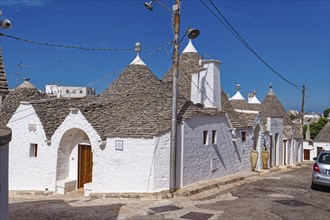 Whitewashed trulli, round houses with stone roofs, in the southern Italian town of Alberobello. The