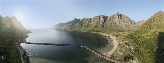 Panoramic aerial view of campsite at beach Ersfjordstranden, fjord Ersfjord, golden restroom, Senja