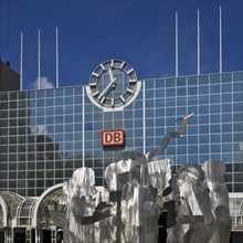 A stainless steel figure group at the main railway station entitled The Ring by Horst Antes,