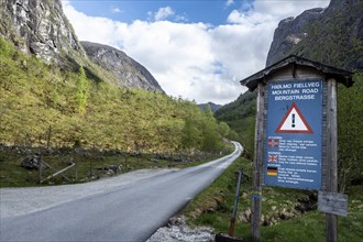 Hjølmo valley near Eidfjord at the Hardangerfjord, warning sign, dangerous and narrow mountain