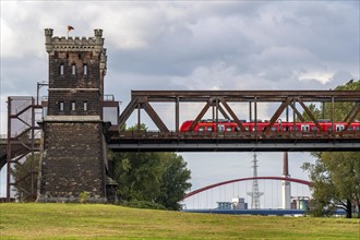 The railway bridge Duisburg-Hochfeld-Rheinhausen, over the Rhine, regional trains and many goods