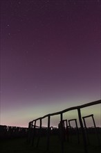 Northern lights (aurora borealis) over the ring sanctuary of Pömmelte, prehistoric circular ditch