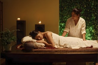 Person blissfully indulges in a tranquil massage in ambient candlelight, AI generated