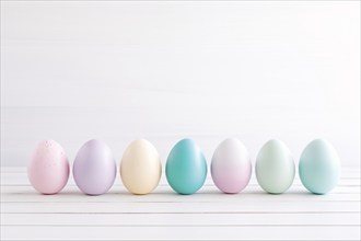 Pastel colored painted Easter eggs on white wooden table with copy space. KI generiert, generiert