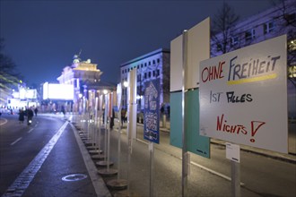 Signs painted by children with, among other things, the inscription Without freedom everything is