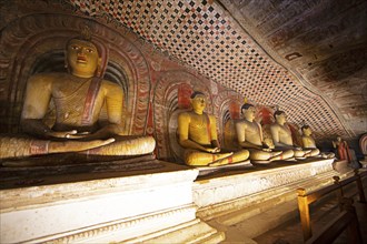 Seated Buddha statues in the Dambulla cave temple, Dambulla, Central Province, Sri Lanka, Asia