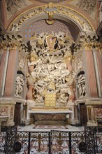 Chancel and high altar with altar reredos, decorations and sculptures of the baroque church