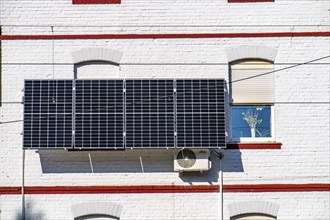 Solar system on the exterior wall of a residential building