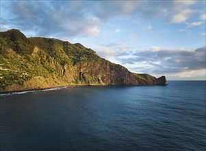 Aerial view of Madeira cliffs coastline landscape on sunrise, Guindaste viewpoint, Madeira island,