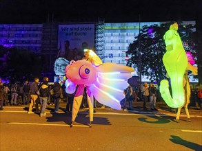 Walking act, underwater, stilt artists float gracefully across the festival as fish, octopus or