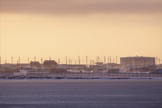 Arctic village in evening light, winter, Kaktovik, Arctic National Wildlife Refuge, Alaska, USA,