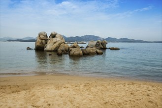 Lonely beach with granite rocks, sunrise, Spiaggia Poltu Manzu, Capo Ceraso, near Olbia, Sardinia,