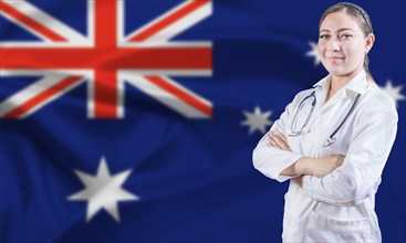 Female doctor on Australia flag. Doctor with crossed arms on Australian flag. Australian Health and