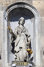 Historic City Hall Stadhuis on the Grote Markt, detailed view of the allegorical statue of Justice