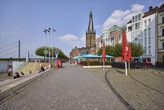 St. Lambert's Basilica with catering and Rhine knee bridge in the old town of Düsseldorf, state