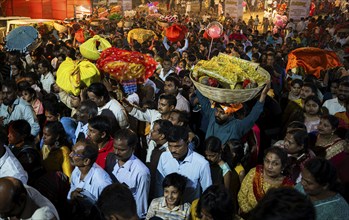 Hindu devotees crowd to perform rituals to the Sun god in the bank of Brahmaputra river on the