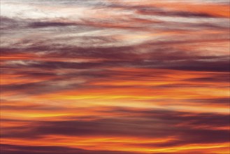 Orange-red coloured cloudy sky after sunset, cloud formation, evening sky, sunset,