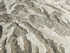 Farmland amongst rocky outcrops. Aerial view. Drone shot. Granada province, Andalusia, Spain,