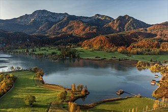 Aerial view of a lake in front of mountains, morning light, autumn, view of Herzogstand and