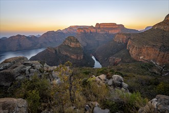 Sunset at Blyde River Canyon with Three Rondawels peak, view of canyon with Blyde River and Mesa