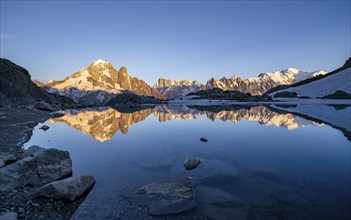 Evening mood, mountain landscape at sunset, alpenglow, water reflection in Lac Blanc, mountain