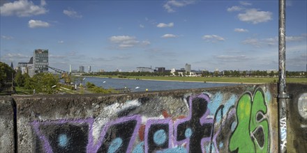 Panorama from the graffiti painted south bridge over the southern Rheinau harbour, the Rhine and