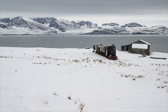 Historic mine railway in winter landscape, Kongsfjord, Ny-Ålesund, Spitsbergen Island, Svalbard and