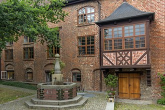 Courtyard with fountain of the Heiligen-Geist-Hospital, founded in the middle of the 13th century,