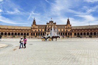 Horse-drawn carriage and pedestrians, tourists on Plaza de Espana, Plaza de España, Seville, Spain,