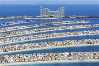 The Palm Jumeirah with Atlantis The Royal Hotel artificial island from above in Dubai, United Arab