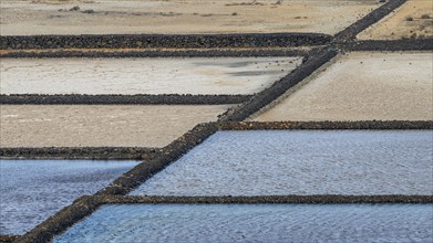 Sea salt extraction, Janubio salt works, Salinas de Janubio, Lanzarote, Canary Islands, Spain,