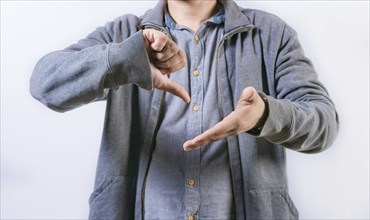 Unrecognizable person talking in sign language isolated. Interpreter gesturing in sign language