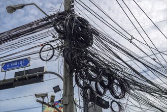 Power lines signpost Lat Krabang Road, Bangkok, Thailand, Asia