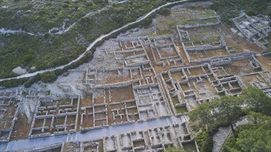 Drone shot, first morning light, Extensive ruins of an ancient site from a bird's eye view, with