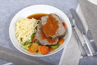 Swabian cuisine, roast beef, roast ox, herb spaetzle, meat dish, gravy, carrot vegetables, leek,