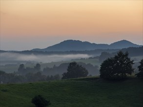 Mountain landscape in evening mood, meadows, forests and fog, Lusatian Mountains, Bohemia, Czech