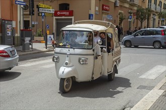 Three-wheeled scooter Ape by Piaggio in a street in Matera, Basilicata, Southern Italy, Italy,